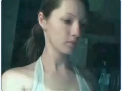 Adorable adolescent darling of legal age pointing to her pink, hairless love tunnel on a webcam